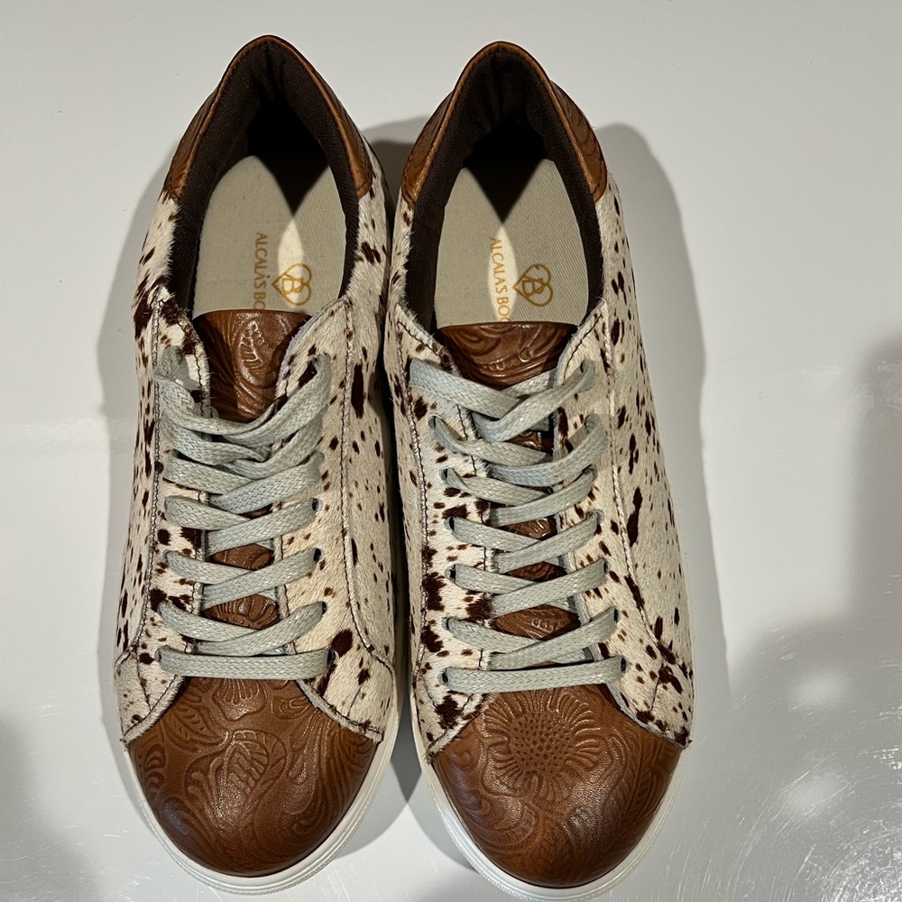 Cow hide and leather shoes. Size 9. 
Worn one time.